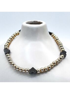 Gold beads with black hearts bracelet.